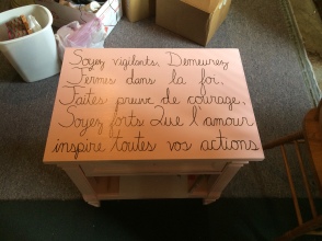 Last year, I purchased a dresser from a thrift store, refurbished it with antique pink paint, and wrote in cursive on the top.